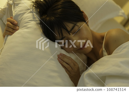 young woman sleeping with pillow young woman sleeping with pillow 108741514
