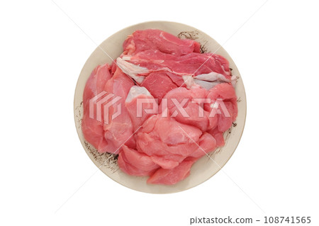 Turkey meat in ceramic plate. Isolated in white background. Raw meat for cooking and barbecue. Top view. Turkey meat in ceramic plate. Isolated in white background. Raw meat for cooking and barbecue. Top view. 108741565