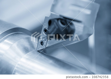 Close up  the  chip insert on the lathe machine in the light blue scene. 108742358