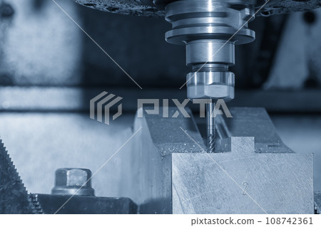 The CNC milling machine cutting press die part by solid bull end mill tool and G-code data background. 108742361