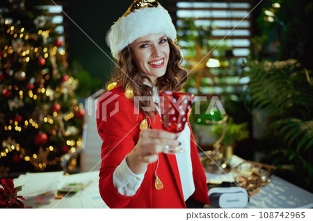 business owner woman in green office with Christmas tree 108742965