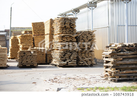 The territory of the wood processing plant.Folded wooden boards at a furniture factory. 108743918
