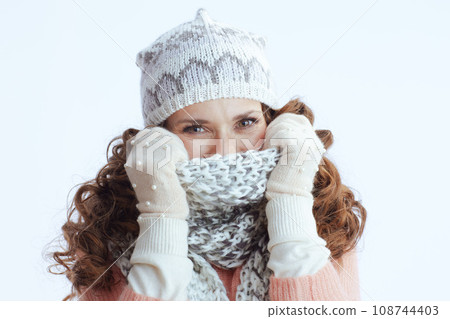 trendy woman on white wrapping up in scarf trendy woman on white wrapping up in scarf 108744403