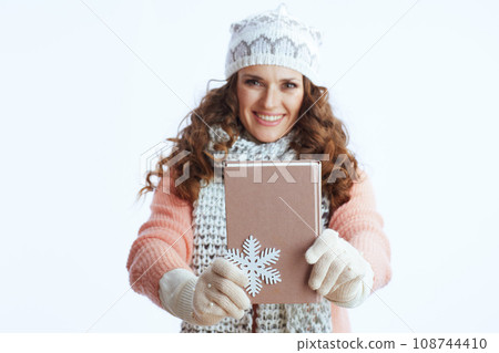 happy trendy woman in sweater, mittens, hat and scarf on white happy trendy woman in sweater, mittens, hat and scarf on white 108744410