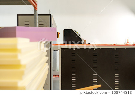 Stacked sheets of foam rubber for furniture production in factory workshop 108744518