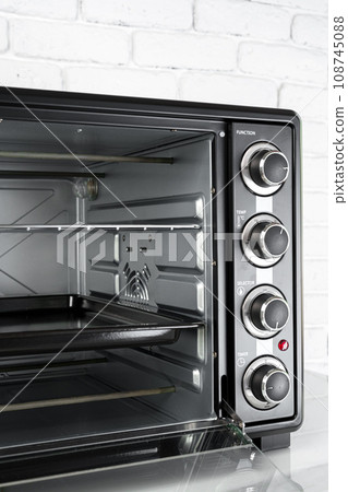 Close up of black mini electric oven home appliance 108745088