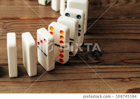 Domino tiles on wooden background close up Domino tiles on wooden background close up 108745584