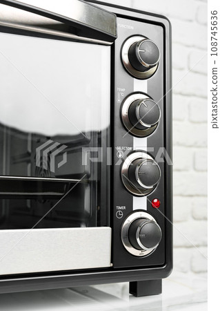 Close up of black mini electric oven home appliance 108745636