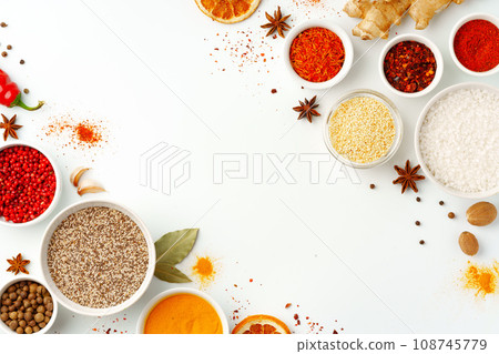 Beautiful composition with various spices on white background Beautiful composition with various spices on white background 108745779