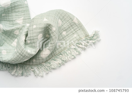 Green muslin blanket for kids on white background 108745793