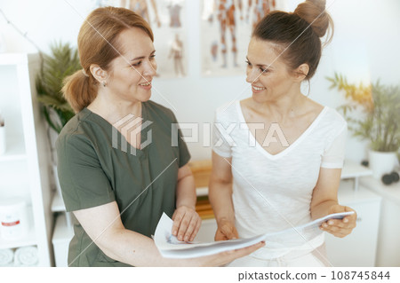 happy female massage therapist conduct educational training 108745844