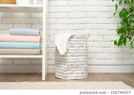Fabric laundry basket in a bathroom close up 108746037