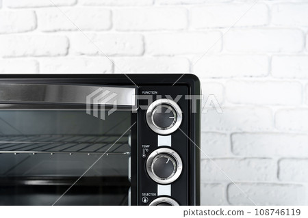Close up of black mini electric oven home appliance 108746119