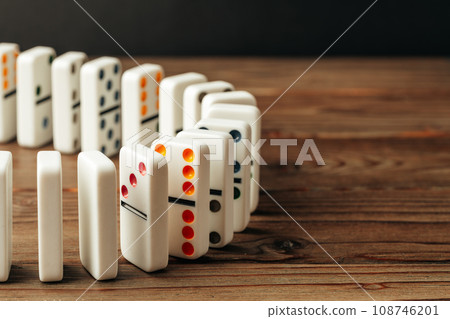 Domino tiles on wooden background close up Domino tiles on wooden background close up 108746201