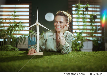smiling business owner woman in green blouse in green office 108746455