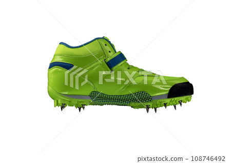 Green glossy sneaker with spikes on a white background. Sport shoes. 108746492