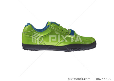 Green glossy sneaker on a white background. Sport shoes 108746499