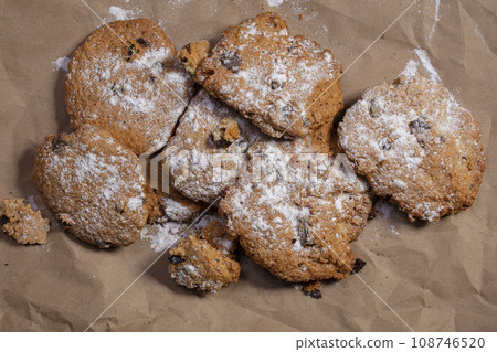 Oat cookies. Baking lies on a crumpled sheet of paper 108746520