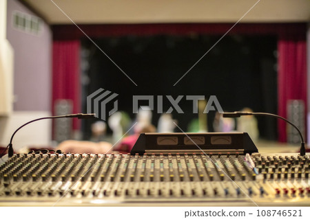 Retro mixing console with stage light. Workplace lighting engineer 108746521