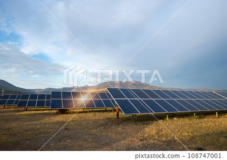 Solar power station. Solar panels, photovoltaics, alternative source of electricity - concept of sustainable and renewable sources. Solar power station. Solar panels, photovoltaics, alternative source of electricity - concept of sustainable and renewable sources. 108747001