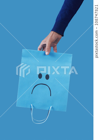 man with an empty sad shopping bag 108747821
