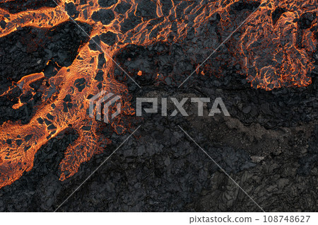 Aerial view of the texture of a solidifying lava field, close-up Aerial view of the texture of a solidifying lava field, close-up 108748627