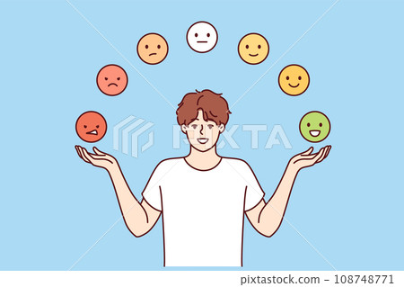 Man trying to maintain emotional balance by juggling emoticons with positive and negative emotions 108748771