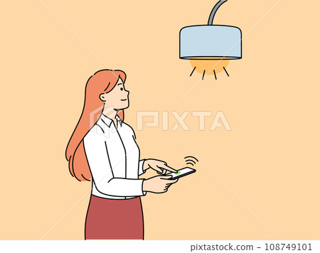 Woman controls lamp through mobile phone with iot or smart home application to turn on light 108749101