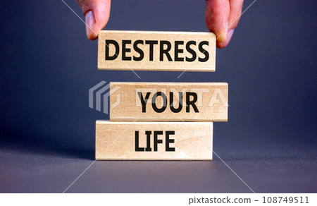 Destress your life symbol. Concept words Destress your life on wooden blocks. Doctor hand. Beautiful grey table grey background. Psychological business and destress your life concept. Copy space. Destress your life symbol. Concept words Destress your life on wooden blocks. Doctor hand. Beautiful grey table grey background. Psychological business and destress your life concept. Copy space. 108749511
