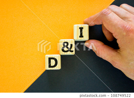 D and I, Diversity and inclusion symbol. Concept words D and I, diversity and inclusion on wooden cubes on beautiful black and yellow background. Business, D and I, diversity and inclusion concept. D and I, Diversity and inclusion symbol. Concept words D and I, diversity and inclusion on wooden cubes on beautiful black and yellow background. Business, D and I, diversity and inclusion concept. 108749522