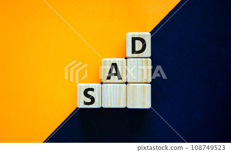 SAD, social anxiety disorder symbol. Concept words 'SAD, social anxiety disorder' on cubes on a beautiful black background. Medical, psychological and SAD, social anxiety disorder concept. Copy space. SAD, social anxiety disorder symbol. Concept words 'SAD, social anxiety disorder' on cubes on a beautiful black background. Medical, psychological and SAD, social anxiety disorder concept. Copy space. 108749523