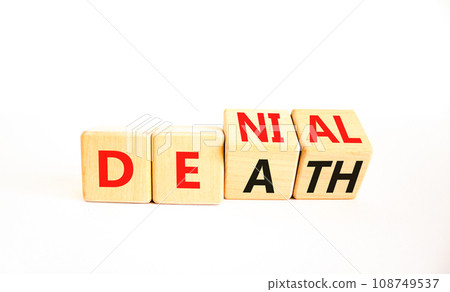 Denial death symbol. Concept words Denial Death on wooden block. Beautiful white table white background. Business denial death concept. Copy space. 108749537