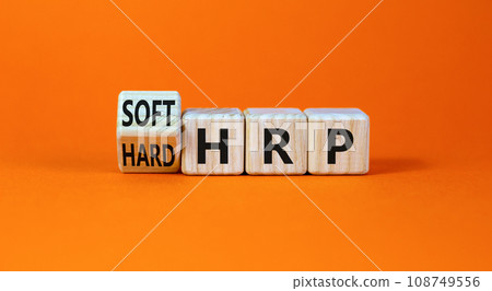 HRP, human resource planning symbol. Turned wooden cubes and changed words hard HRP to soft HRP. Beautiful orange background. Business, HRP, human resource planning concept. Copy space. HRP, human resource planning symbol. Turned wooden cubes and changed words hard HRP to soft HRP. Beautiful orange background. Business, HRP, human resource planning concept. Copy space. 108749556