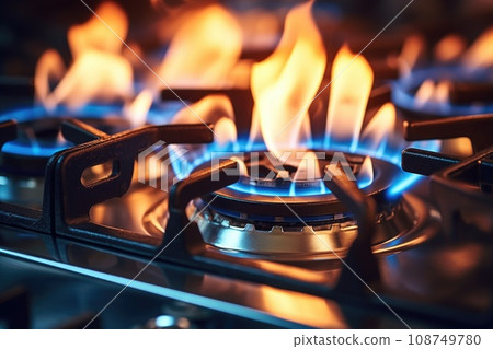 Kitchen gas stove with blue gas flames. Global gas crisis and rising prices. Kitchen gas stove with blue gas flames. Global gas crisis and rising prices. 108749780