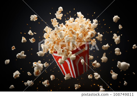 Popcorn flying out of the package. Popcorn flying out of the package. 108749811