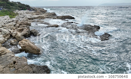 Aerial view of sea waves hitting the rocks with drone Aerial view of sea waves hitting the rocks with drone 108750648