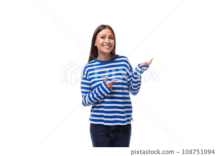 european brunette young lady wears a striped white-blue blouse and jeans on a white background 108751094