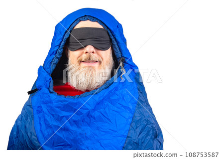 bearded man in a sleeping bag on a white background. equipment for recreation in tourism and travel bearded man in a sleeping bag on a white background. equipment for recreation in tourism and travel 108753587