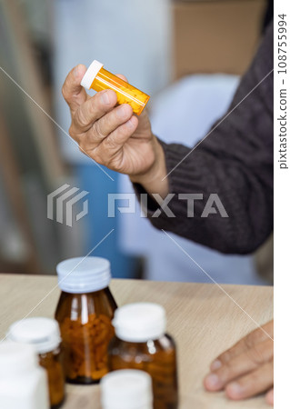 caucasian woman is sitting on prescription medication prescribed by doctor 108755994