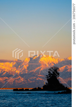 Tateyama mountain range (Tsurugi-dake) at dusk as seen from the Amaharashi coast Tateyama mountain range (Tsurugi-dake) at dusk as seen from the Amaharashi coast 108756077