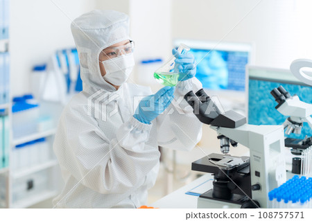 Young female researcher doing research and development in a clean room 108757571