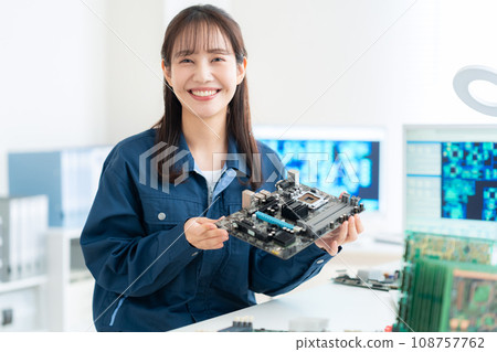 Young female engineer inspecting the board 108757762