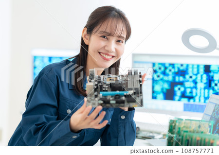 Young female engineer inspecting the board 108757771