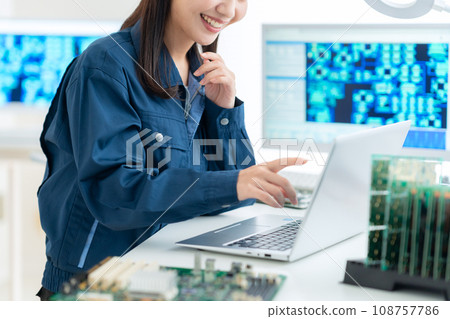 Young female engineer inspecting the board 108757786