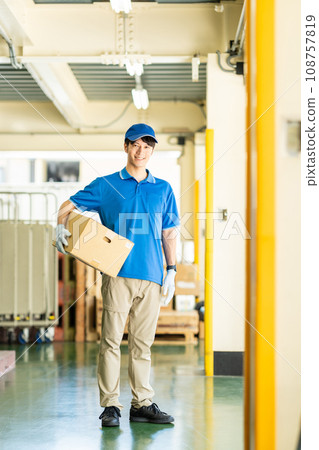 Male driver working in a warehouse Male driver working in a warehouse 108757819
