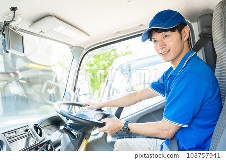 Male delivery staff driving Male delivery staff driving 108757941