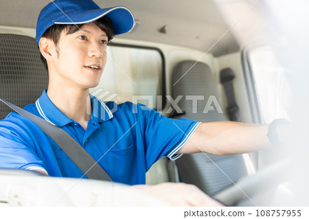 Male delivery staff driving Male delivery staff driving 108757955