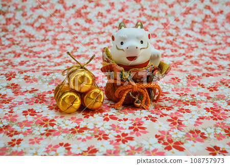 New Year's card background with dragon figurines and rice bags 108757973