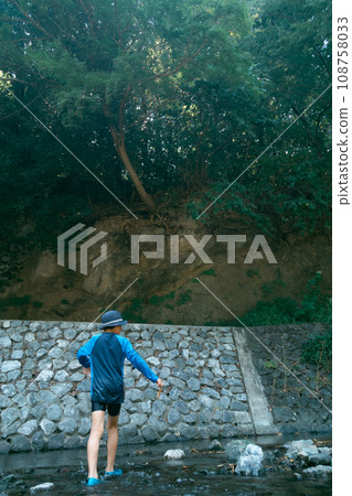 outing to the riverside, playing in a river, younger 108758033