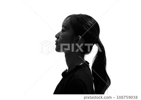 Profile silhouette of a woman looking up Profile silhouette of a woman looking up 108759038